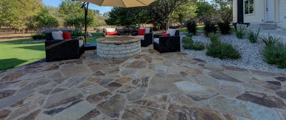 Paver patio in New Braunfels, TX, with a fire pit.