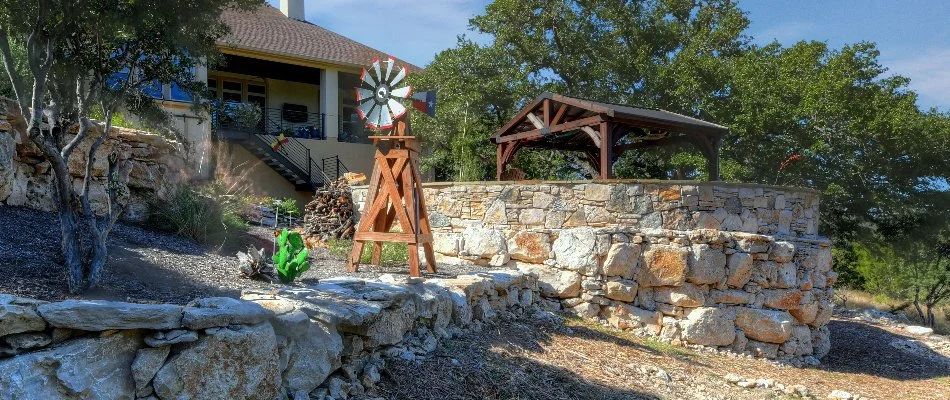 Retaining wall, pavilion, and a small windmill in New Braunfels, TX.