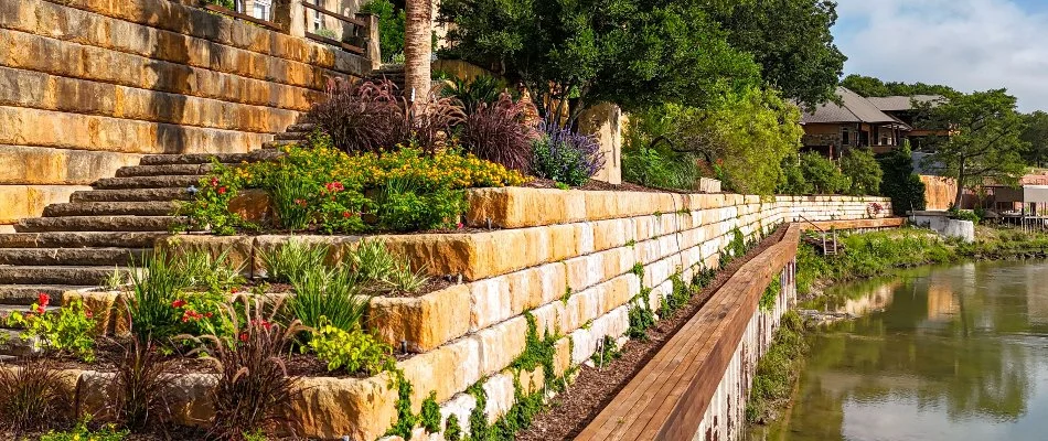 Retaining wall in New Braunfels, TX, with planter beds.