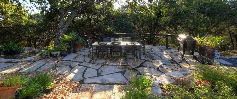 Flagstone patio with a dining table in New Braunfels, TX.