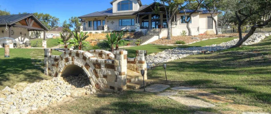 French drain running across a yard in New Braunfels, TX.