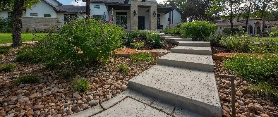 Outdoor steps with surrounding landscape beds in Canyon Lake, TX.