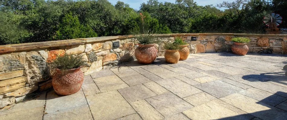 Paver patio in New Braunfels, TX, with plants.