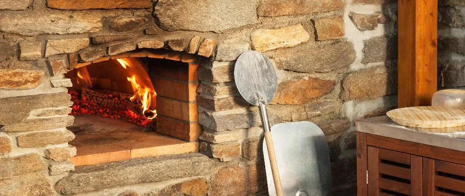 Pizza peel beside a pizza oven in New Braunfels, TX.